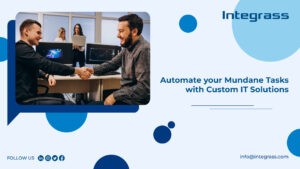 Two guys shaking hands sitting in front of a montior and the text on the right reads”Automate Your Mundane Tasks with Custom IT Solutions from Integrass”